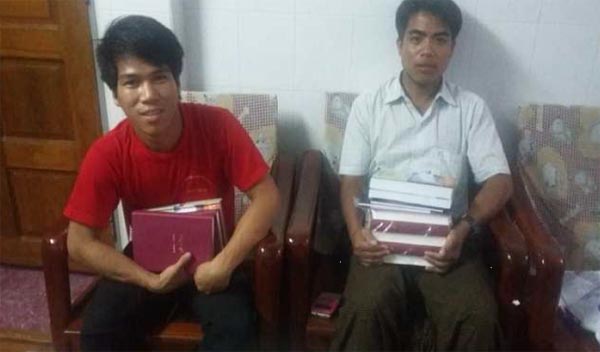 Alumni of South East Asia Bible College distribute Bibles.