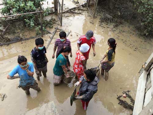 People from South East Asia Bible College help with flood relief works in Kale, Myanmar.