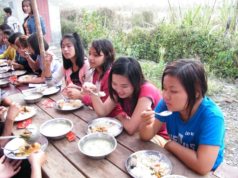 Lunch time during summer youth camp in Kalemyo, Myanmar.