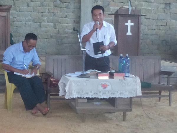Brother Khai Thie preaching the gospel at Crusade