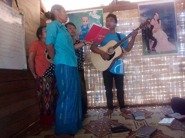 Singing at Sunday worship service at Kyauksuh Village