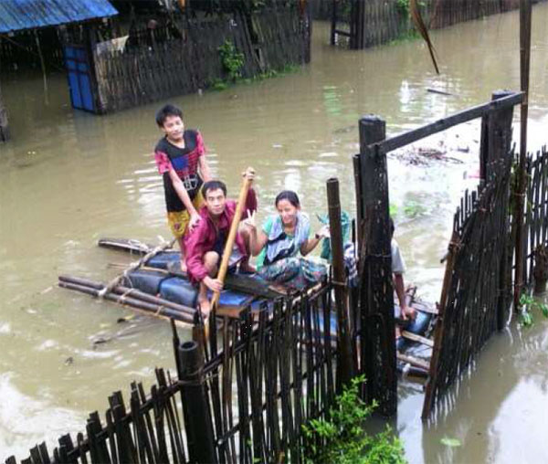 Bro. Nar Haw is riding a bamboo boat